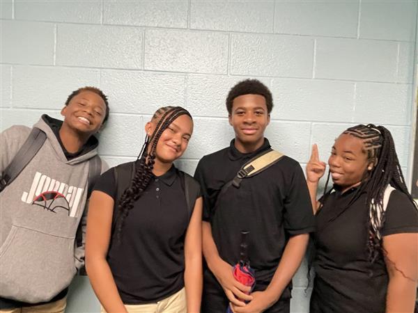four students posing